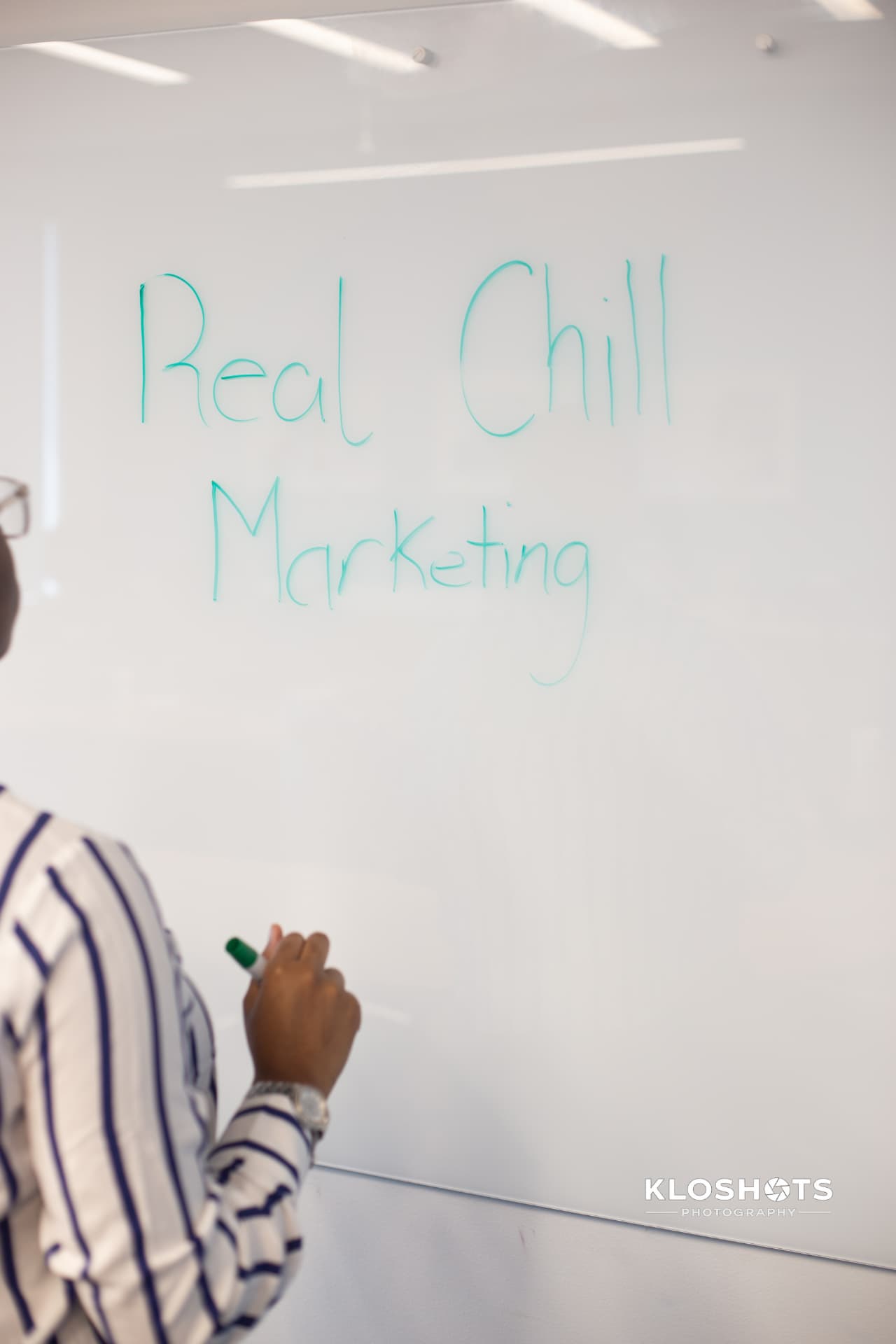 Whiteboard with RealChill Marketing written on it during a strategy session